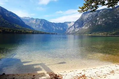 a view of a lake with mountains in the background at Villa Frida in Bohinj