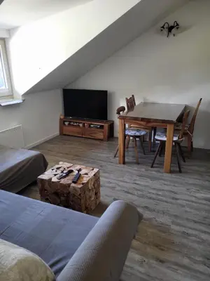 a living room with a table and a dining room at Apartment Soul with Free Parking in Kranjska Gora