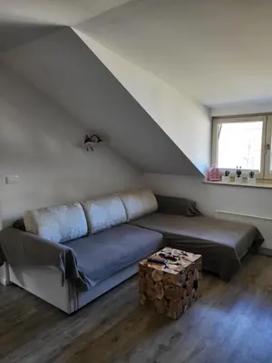 a living room with a couch and a table at Apartment Soul with Free Parking in Kranjska Gora