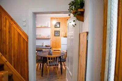 a kitchen and dining room with a table and chairs at Alpine Home - Rooms in Kranjska Gora