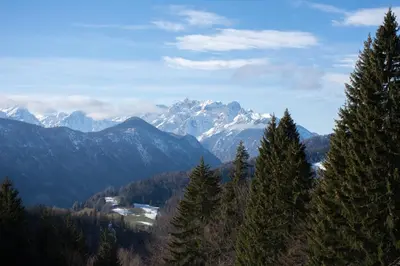 a view of a mountain range with snow capped mountains at Alpine Cottage Golica in Jesenice
