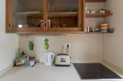 a kitchen counter with a blender on a counter top at Private green getaway in Bled