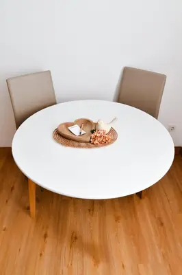 a white table with two chairs and a bowl of food at Miadora apartments - Apartma Idina in Moravske Toplice