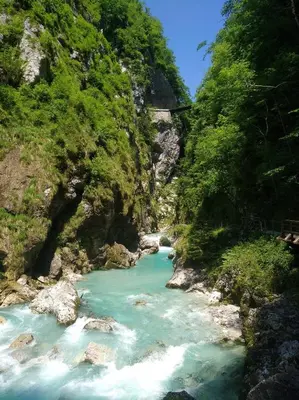 a river in a canyon with blue water at Apartma Gorjan in Tolmin