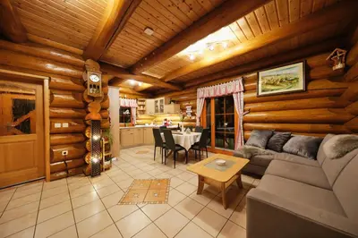 a living room with a couch and a table at Mia Bella luxury chalet in Slovenske Konjice in Slovenske Konjice