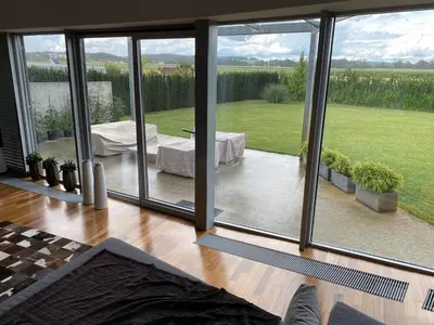 a living room with a large sliding glass door at Residence in Moravske Toplice