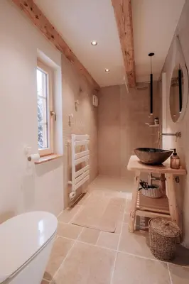 a bathroom with a tub and a sink and a toilet at Lovely Cottage in a mountain wilderness of the National Park in Srednja Vas v Bohinju