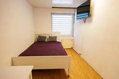 a bedroom with a bed and a window at Mojstranka in Mojstrana