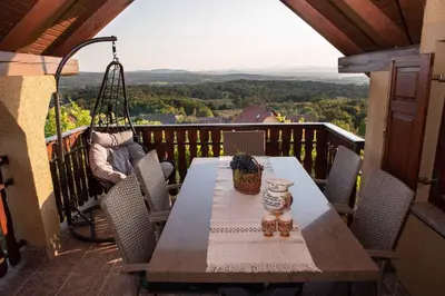 a table and chairs on a balcony with a view at Holiday home in Metlika Kranjska Krain 26051 in Metlika