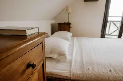 a bedroom with a bed with a book on a dresser at Holiday home in Smarje pri Jelsah Stajerska Untersteiermark 26087 in Šmarje pri Jelšah