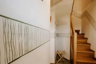 a hallway with stairs and a wall with lines on it at Holiday home in Smarje pri Jelsah Stajerska Untersteiermark 26087 in Šmarje pri Jelšah