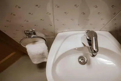 a bathroom with a white sink and a toilet at Holiday home in Smarje pri Jelsah Stajerska Untersteiermark 26087 in Šmarje pri Jelšah