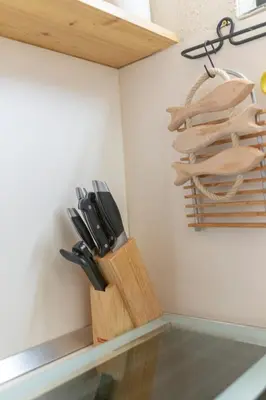 a bunch of knives in a knife holder on a wall at Apartma Brlog Petra, Kranjska Gora in Kranjska Gora