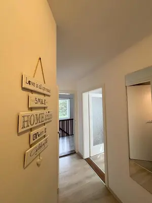 a hallway of a home with signs on the wall at Apartments Heart in Ljubljana