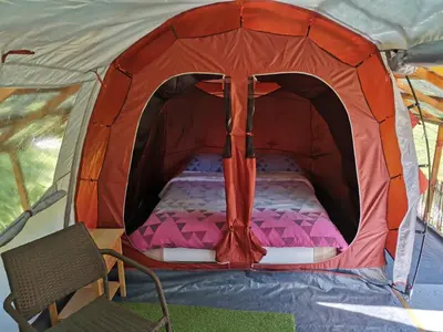 a tent with a bed in the middle at Camping Silva in Ljutomer