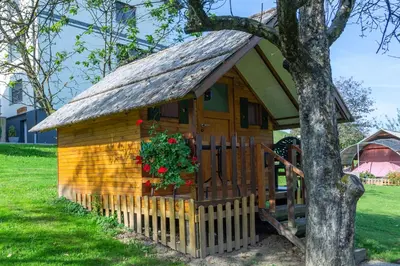 a small wooden house with a roof at Camping Silva in Ljutomer
