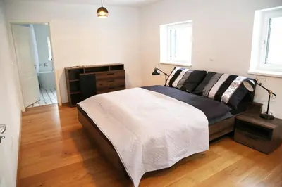 a bedroom with a bed and a dresser in it at Maribor Luxury Country House Volicina 5* in Spodnja Voličina