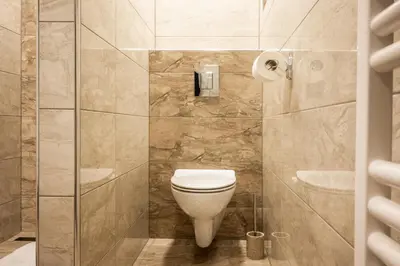 a bathroom with a toilet and a shower at Apartma Tia 2 in Zreče