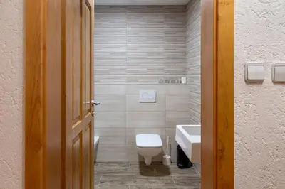 a bathroom with a toilet and a sink at Gostišče Marin Miler in Prevalje