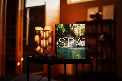 a table with a vase and some bread on it at Holiday House Sunset Spa in Šentjernej