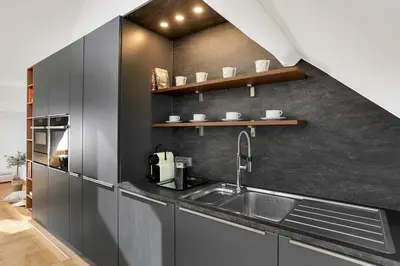 a kitchen with a sink and a counter top at Ljubljana Palace Suites in Ljubljana