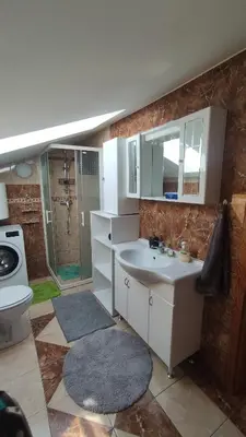 a bathroom with a sink and a toilet and a shower at Prijetno stanovanje v bližini Term 3000 - Vivat in Moravske Toplice