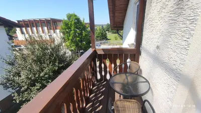 a balcony with a table and chairs on it at Prijetno stanovanje v bližini Term 3000 - Vivat in Moravske Toplice