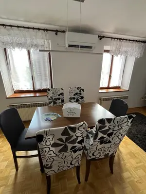 a dining room with a table and chairs at Apartma Zdar in Kobarid