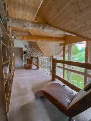 a living room with a swing in a house at Koča na samem Prestiž in Šalovci
