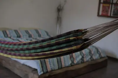 a hammock on a bed in a room at Entire apartment in the center with free parking in Ljubljana