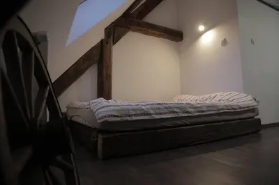 a room with a bed in a room with at Entire apartment in the center with free parking in Ljubljana