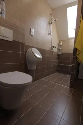 a bathroom with a toilet and a shower at Entire apartment in the center with free parking in Ljubljana