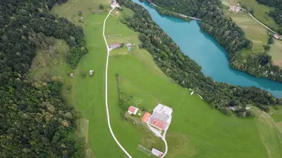 an aerial view of a park next to a river at Apartma Patricija - Cozy apartments for 2 or 4 people in Tolmin