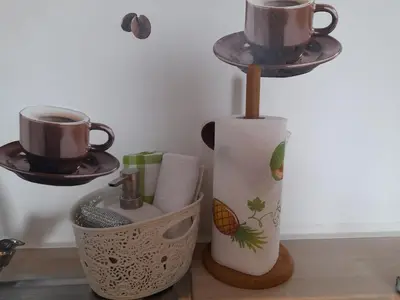 a kitchen counter with two cups on a holder at Apartma Lena in Kranjska Gora