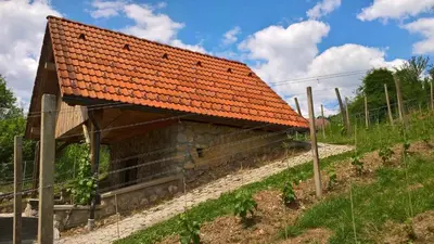 an old building with an orange roof on a hill at Holiday home in Otocec Kranjska Krain 26062 in Otočec
