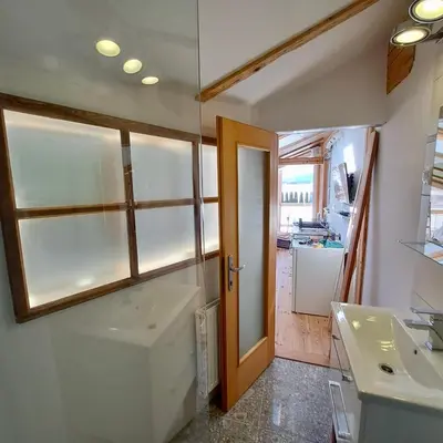 a small kitchen with a sink and a window at Mini Loft close to Logar Valley in Rečica ob Savinji