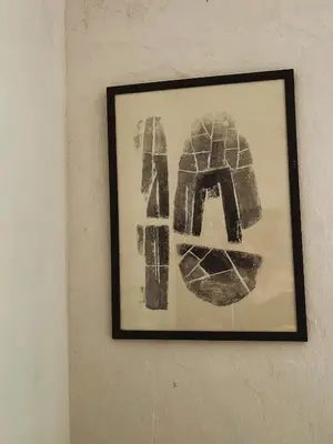 a picture hanging on a wall with the word art at HIŠA VELIKANKA_Giantess in Kostel