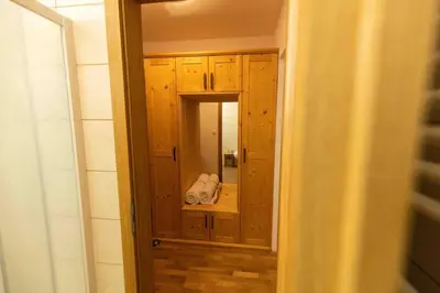 a doorway to a room with a mirror in a bathroom at Pr'Finzgar in Brezje