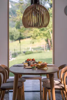 a wooden table with a plate of food on it at Holiday House BALE, BALE in Kostel
