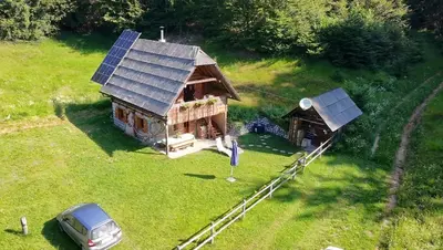 an aerial view of a house with solar panels on it at Apartment in Chalet Goldilocks in Zgornje Gorje