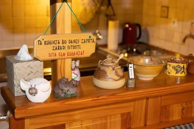 a wooden counter with a sign on top of it at Apartment in Chalet Goldilocks in Zgornje Gorje
