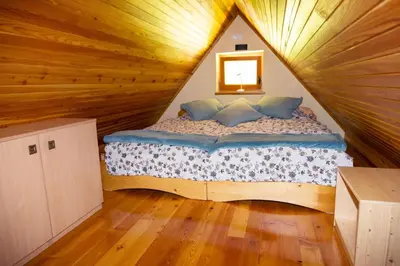 a bedroom with a bed in a tree house at Apartment in Chalet Goldilocks in Zgornje Gorje