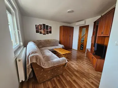 a living room with a couch and a table at zidanica Bunderšek in Šentjanž