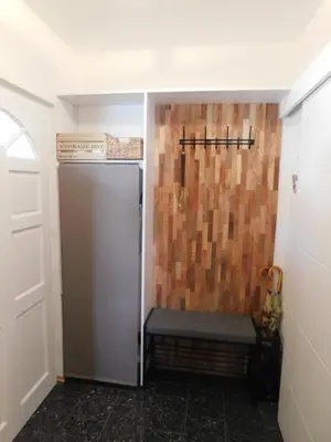 a bathroom with a shower with a bench in it at Vali's Paradise in Ptuj