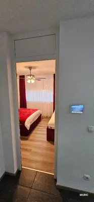 a view of a bedroom with two beds in it at Apartmani MURIC Ljubljana in Ljubljana