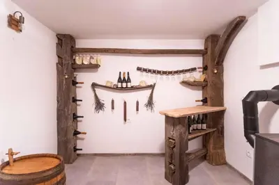 a wine tasting room with wooden elements on the wall at Holiday home in Sentvid pri Sticni - Zentralslowenien 43927 in Šentvid pri Stični