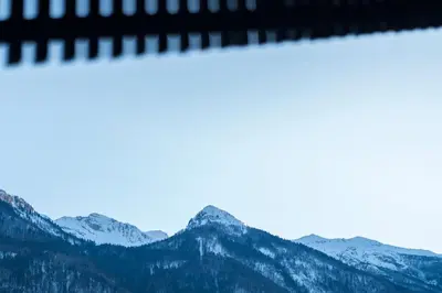 a picture of mountains with snow on them at DREAM & RELAX Apartment in Bohinj