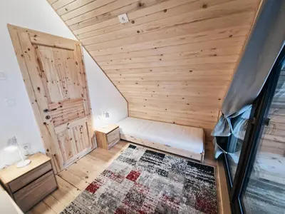 a room with a sauna with a wooden ceiling at HIŠA ZIMAZAKON BLOKE in Nova Vas