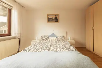 a bedroom with a large white bed in a room at Apartment Mountain Sunrise in Škofja Loka