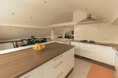 a kitchen with a bowl of fruit on a counter at Apartment Mountain Sunrise in Škofja Loka